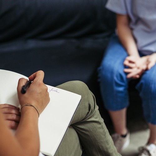 Psychotherapy session, woman talking to his psychologist in the studio